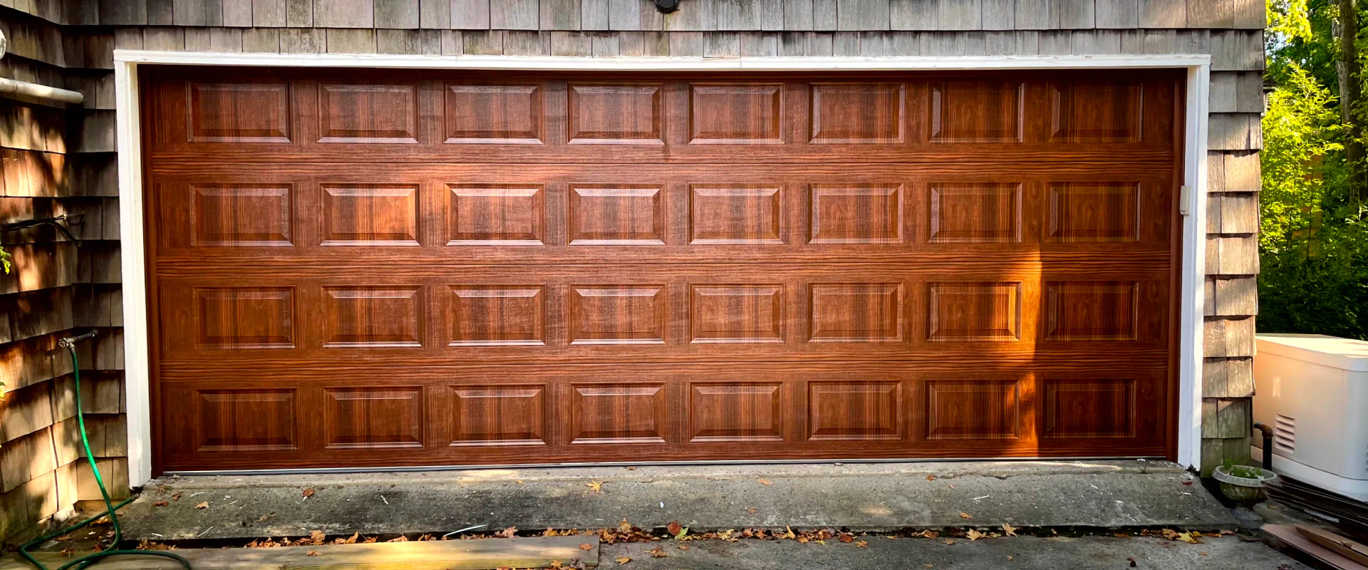 wooden garage door installed in a residential house